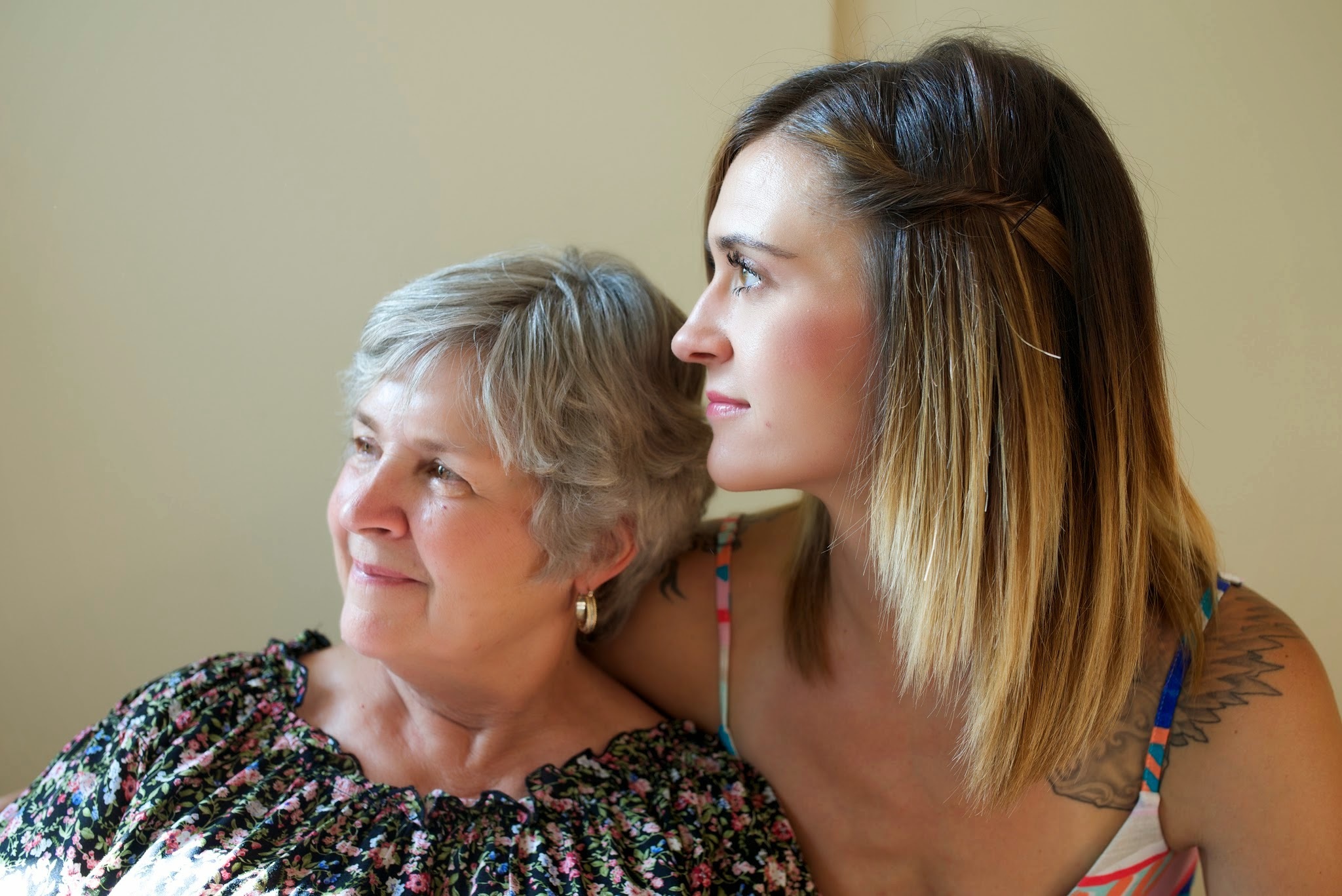 Mother and daughter looking towards the lefy