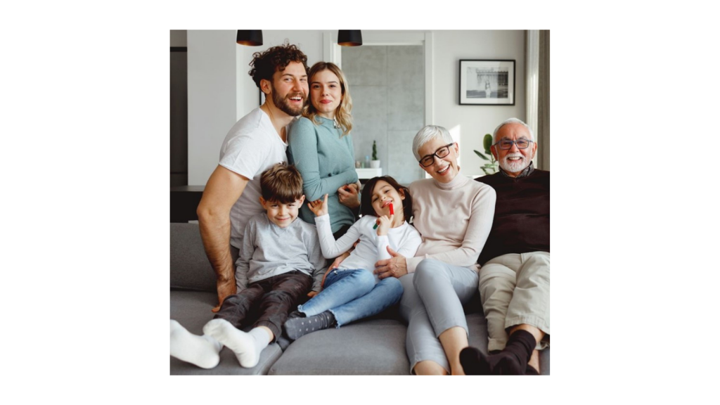 Family of different ages sat on the sofa.