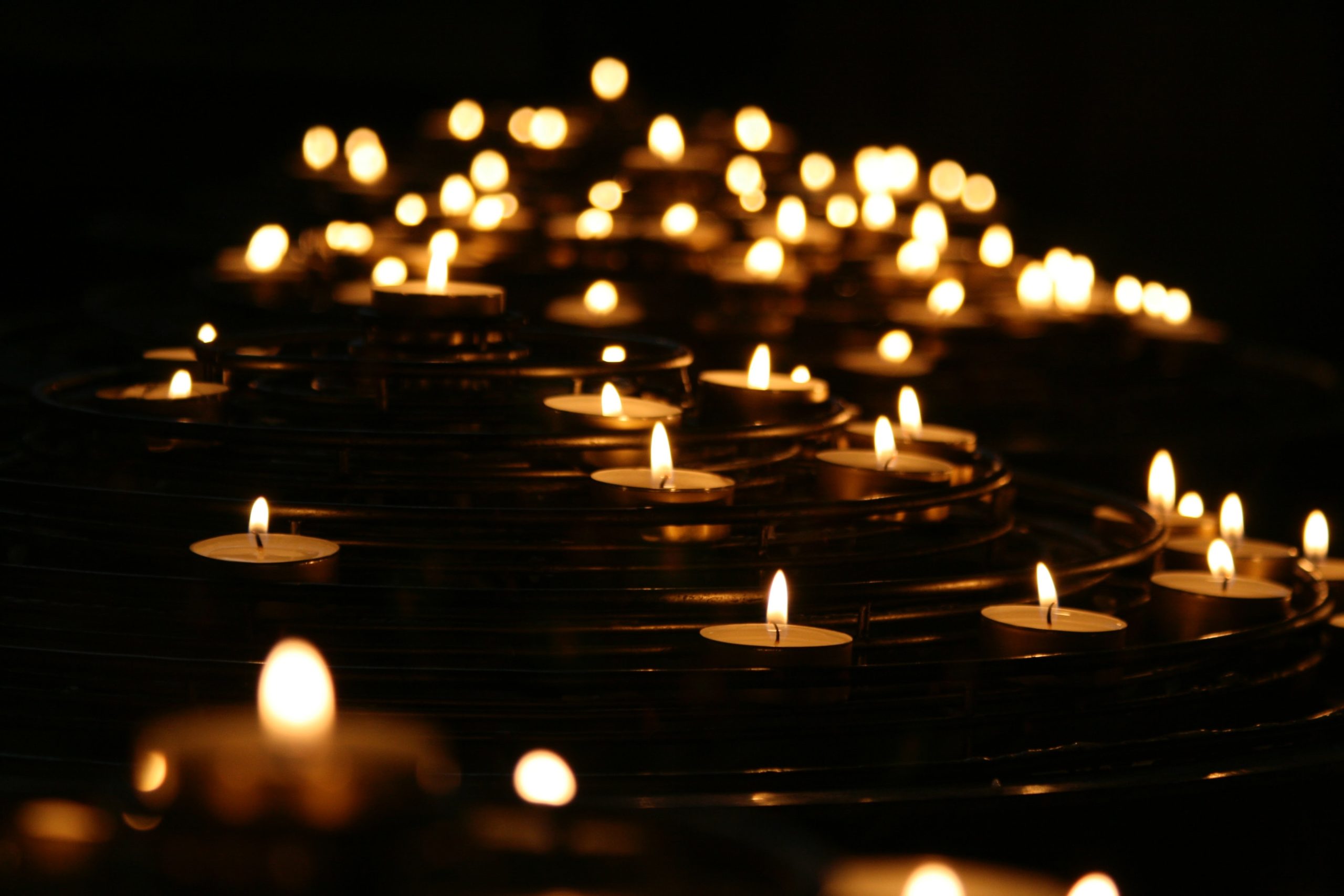 Lots of lit tealight candles arranged