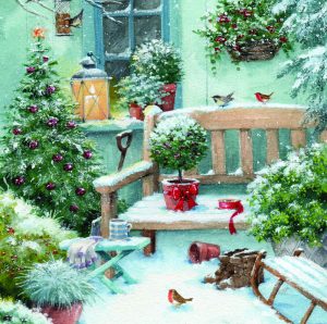 A snowy garden, with a Christmas tree and lots of other plants covered in snow