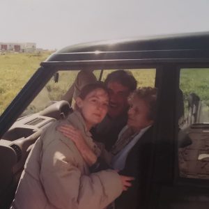 Laura is in a parked car with her granny and uncle.