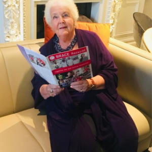 Stephanie Cole reading a BRACE magazine