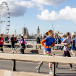 Runners taking part in the half marathon, in the back ground is the London Eye.