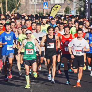 A big group of runners taking part in a half marathon race.