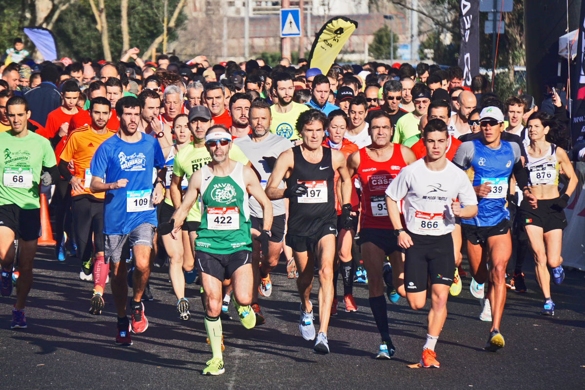 A big group of runners taking part in a half marathon race.