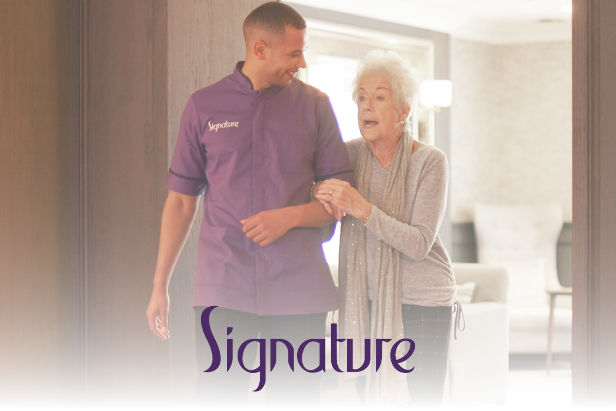 Signature Corporate Partnerships An elderly woman walks arm-in-arm with a smiling caregiver in a purple 'Signature' uniform, inside a well-lit, elegant care home. The 'Signature' logo is displayed at the bottom.