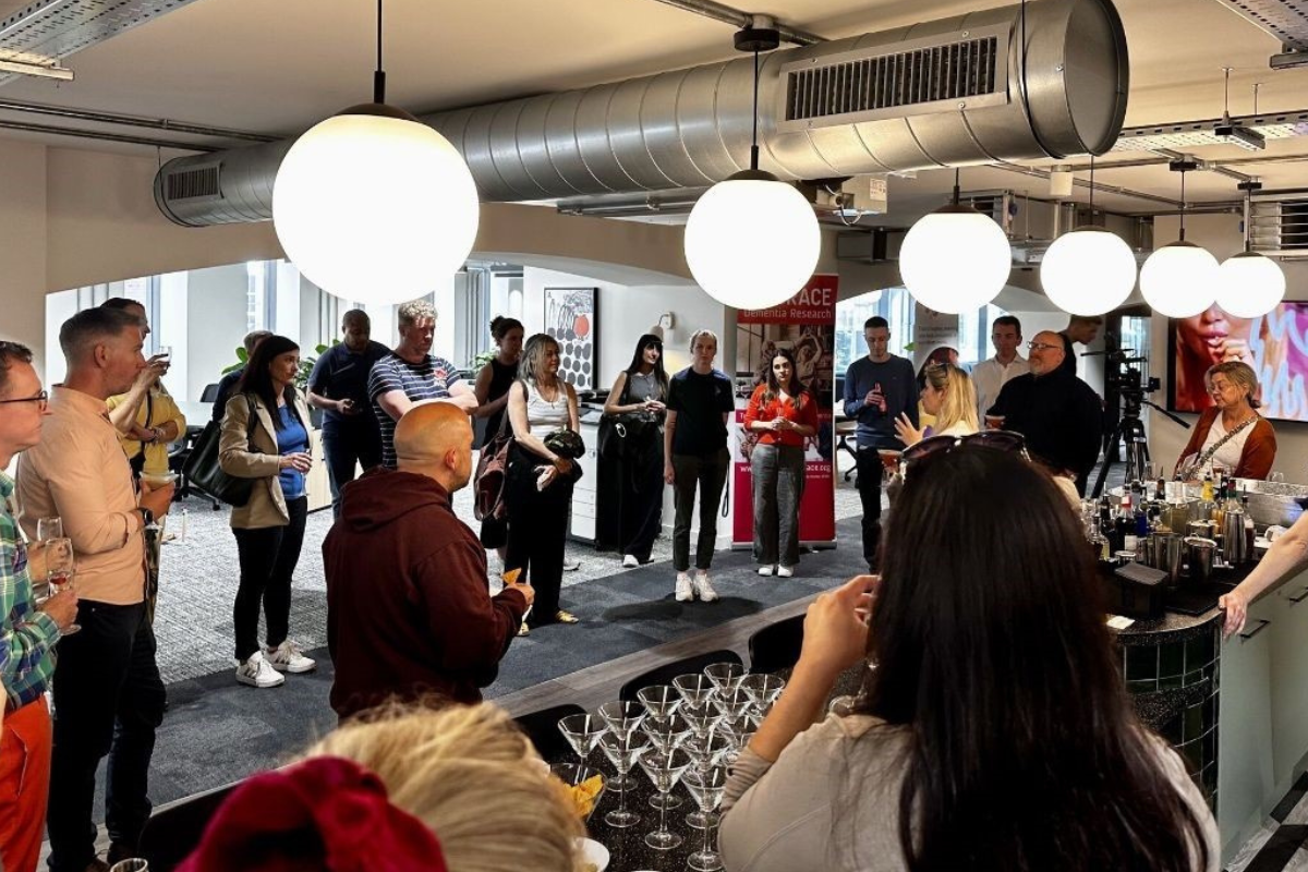 A networking event in a bar with lots of people.