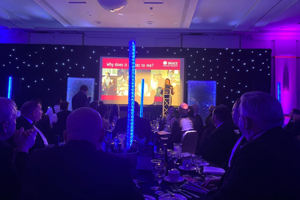 BRACE CEO, Liberty Harrison, speaks on stage at the CIBSE South West Regional Dinner