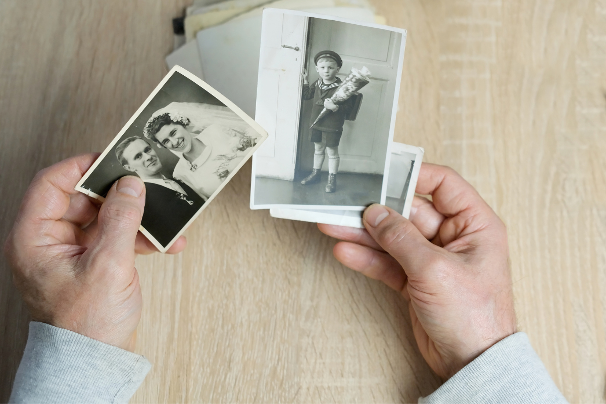 Hands holding black and white photos