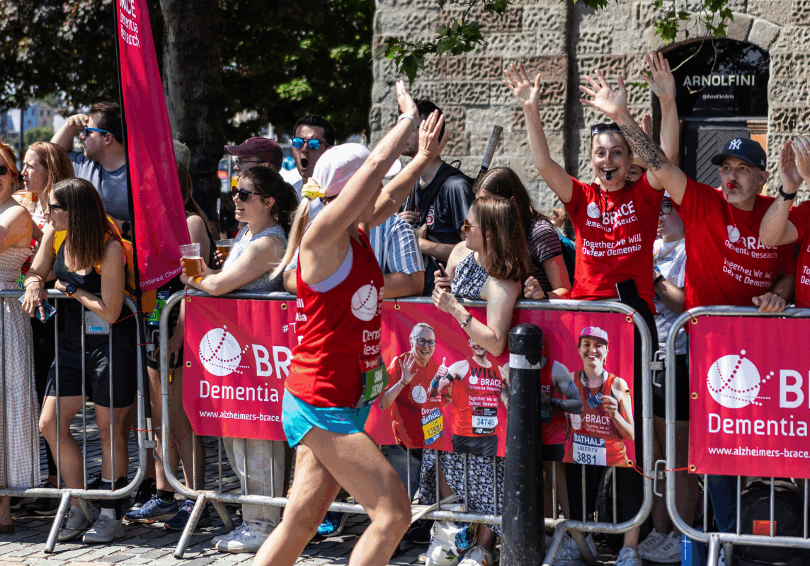 A BRACE runner at the Bristol 10k running past the BRACE cheer point.
